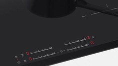 Grande plano dos comandos de uma placa de indução