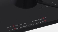 Grande plano dos comandos de uma placa de indução